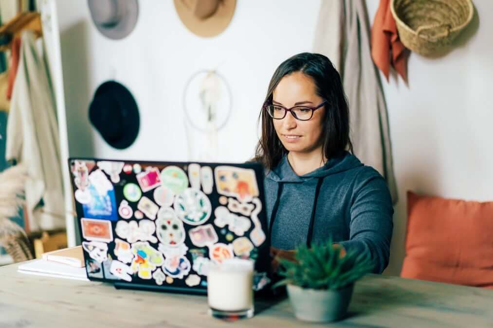 Girl researching how much does it cost to become a travel agent