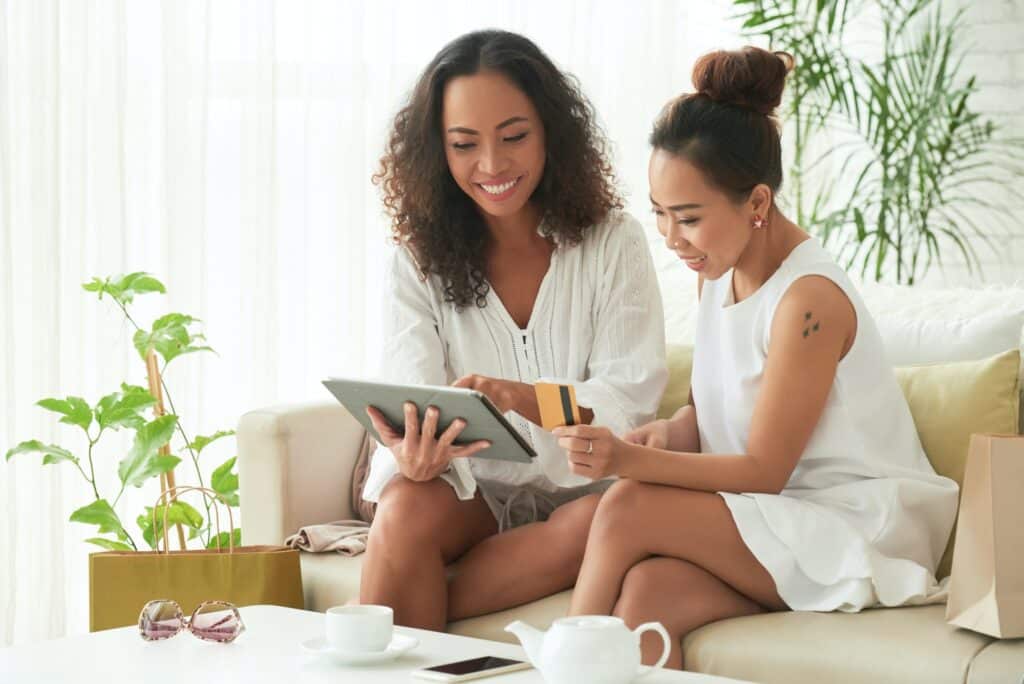 Become a travel agent - two ladies looking at a computer