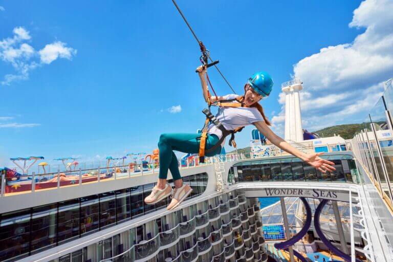 Royal Caribbean travel agent swinging on a cruise ship