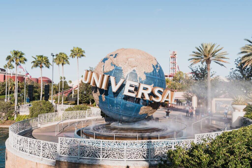 Universal Studios travel agent at main park sign